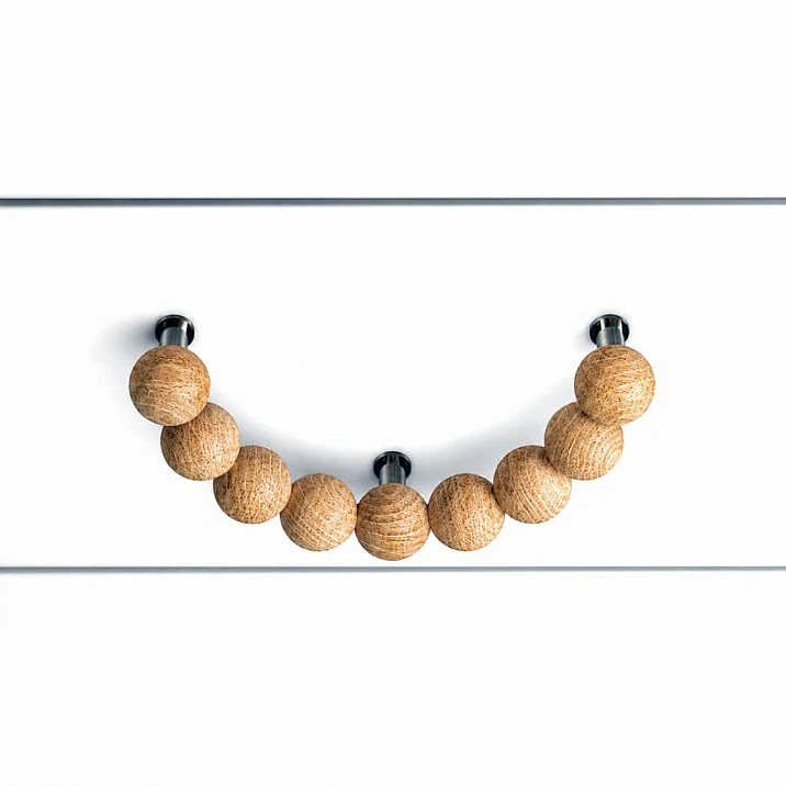 Wooden furniture handle Eclipse HL-072.1 in the shape of a half-ring made of spheres, front view on the facade