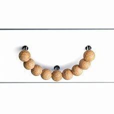 Wooden furniture handle Eclipse HL-072.1 in the shape of a half-ring made of spheres, front view on the facade