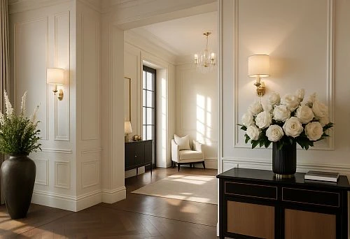 Elegant interior with a console table, bouquet of white roses, and a chair in a bright room with moldings