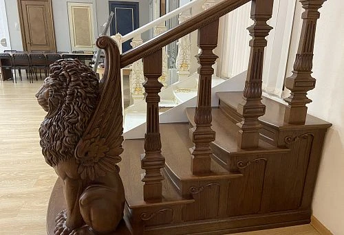 Wooden balustrade handrails with elegant carving and decorative elements