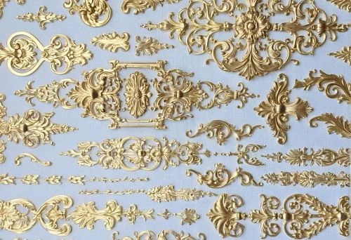 Luxurious gold decorative appliqu&eacute;s for furniture and shelves