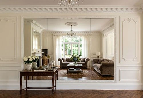 Mirror panels and polyurethane moldings on the wall in a modern interior