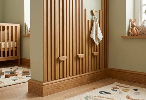 Wooden baseboard and wall slats in a children's room interior