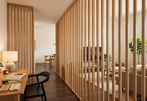 Slat partition for zoning the living room and kitchen