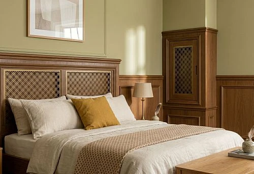 Decorative wooden bed headboard in bedroom interior