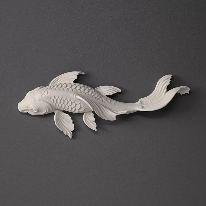 Wall panel with backlighting and decorative polyurethane fish with gold finish in a modern interior.
