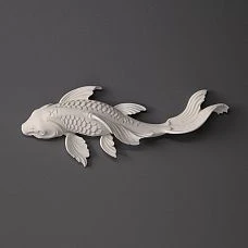 Wall panel with backlighting and decorative polyurethane fish with gold finish in a modern interior.