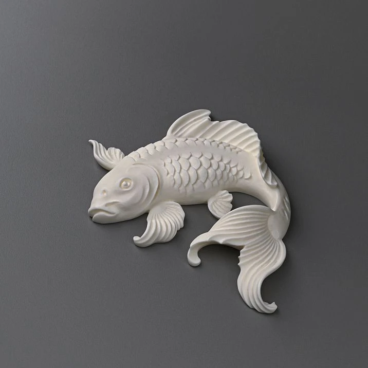 Original stucco composition in the shape of fish on the wall of a modern interior from STAVROS.
