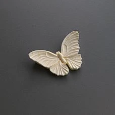 Polyurethane appliqu&eacute; NPU-489 in the shape of an elegant butterfly for a stylish interior photo