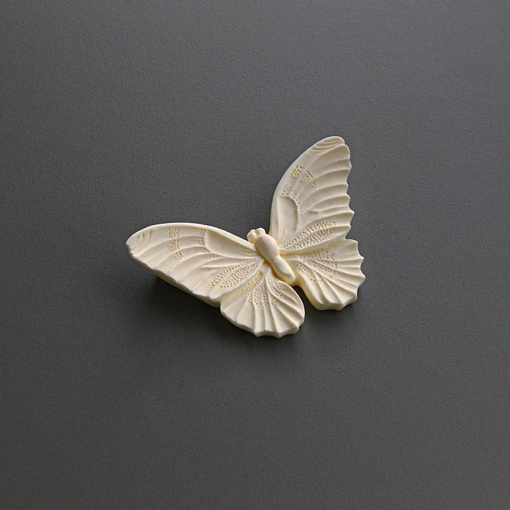Polyurethane appliqu&eacute; NPU-489 in the shape of an elegant butterfly for a stylish interior photo