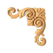 Baroque-style carved wooden inlay depicting the sun and flowers