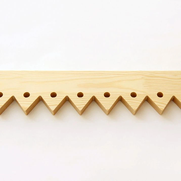 Facade of a wooden house with carved door stops NL-5