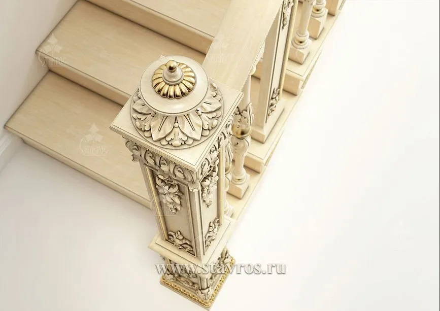 Unique carved finial on a post with gold leaf