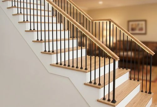 Wooden staircase railing with balusters, handrails, and posts