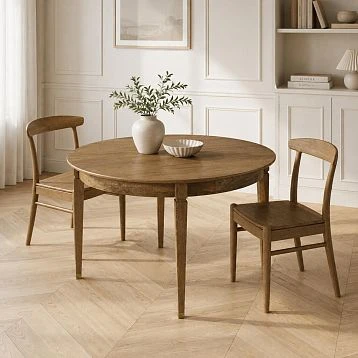Round solid wood table York 002-011 with Archie 003-003 chairs in a modern interior