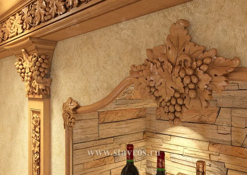 Arched opening with carved panel decorated with grapevine and floral elements