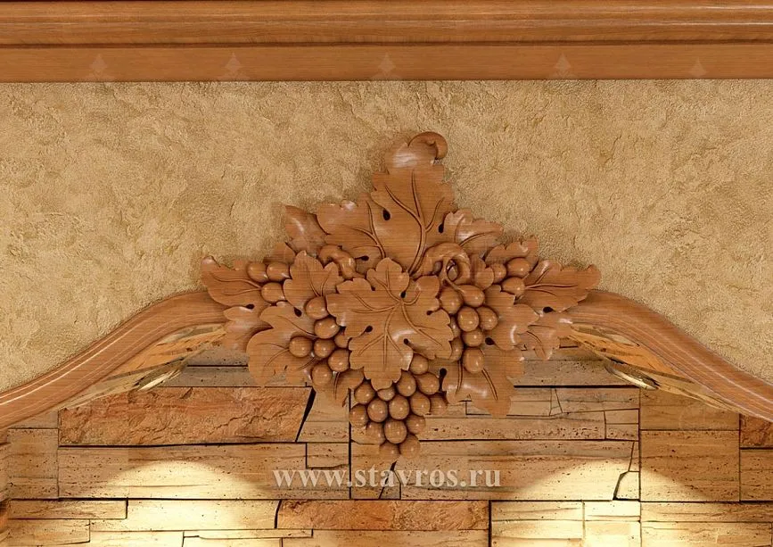 Fragment of wine cellar wall with carved grape cluster applique and architectural details