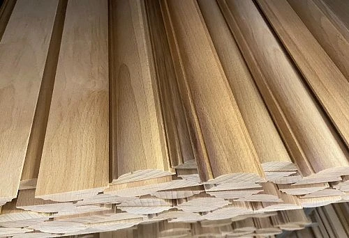 Various types of wooden siding and decorative trim for wall finishing